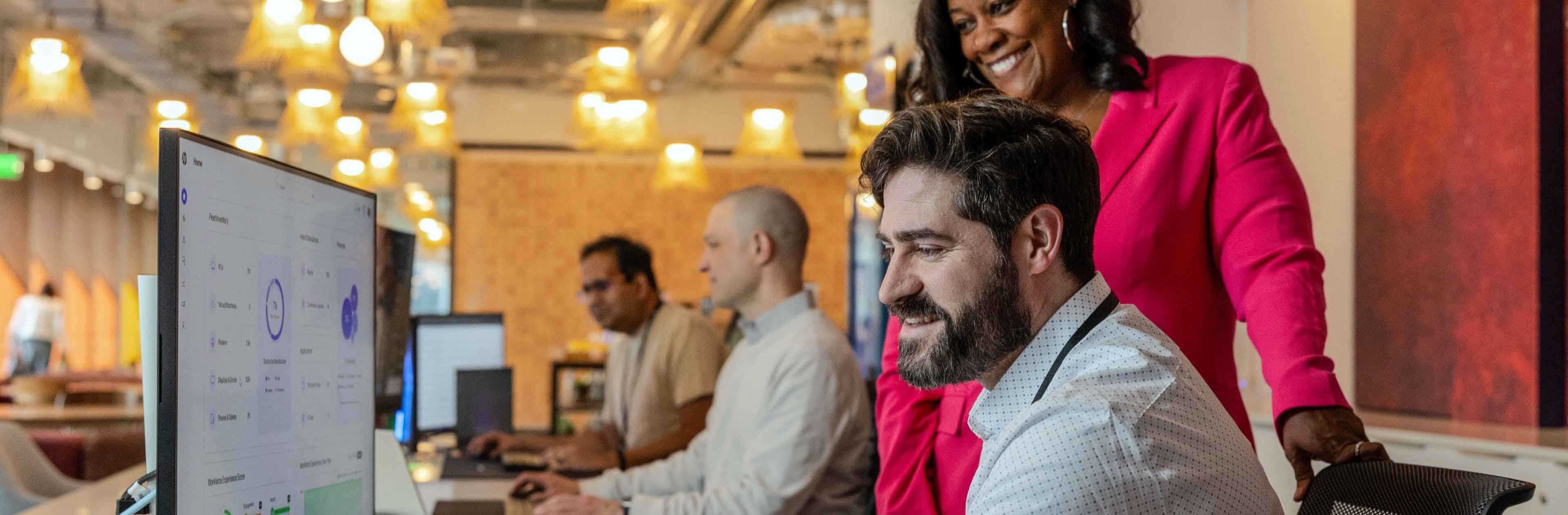 HP employees look at computer