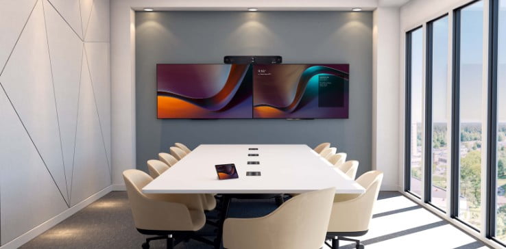 Large empty conference room with Poly Studio X70 video bar above monitors and touchscreen meeting controller on table Poly Large empty conference room with Poly Studio X70 video bar above monitors and touchscreen meeting controller on table Poly